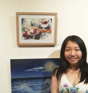 Claudia Anne Lee with her award winning work "Books and Bouquets".